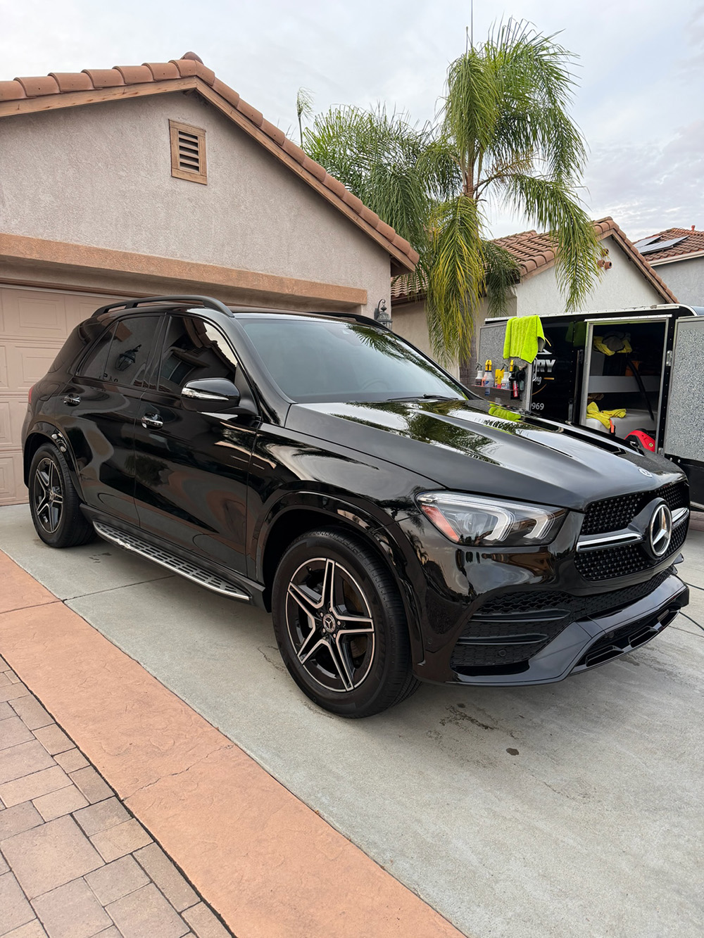 Black Mercedes GLE after a completed ceramic coating application, glass-like finish