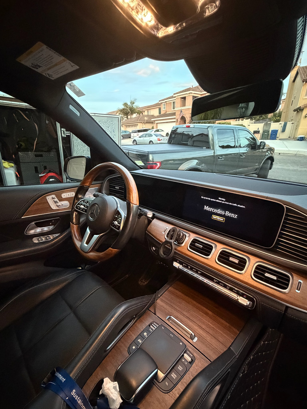 Mercedes GLE leather seats and wood trim after a full interior detail service, Chula Vista mobile car care