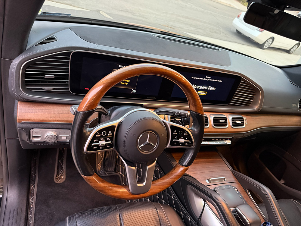 Mercedes Benz wood trim and steering wheel detailed as part of a luxury interior service