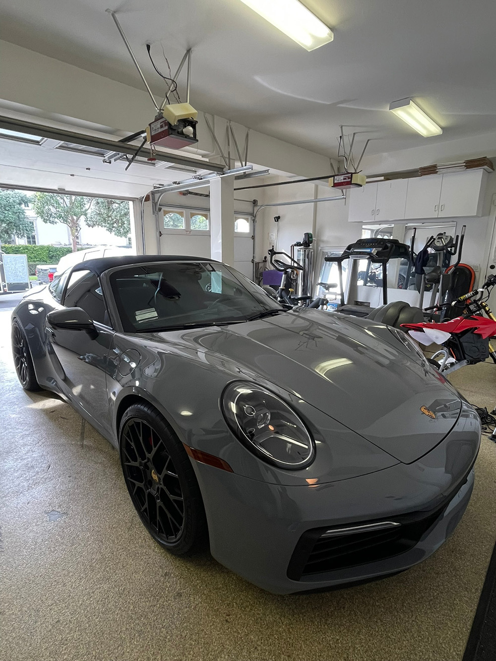 Porsche 911 mid paint correction in a home garage, swirl removal before ceramic coating