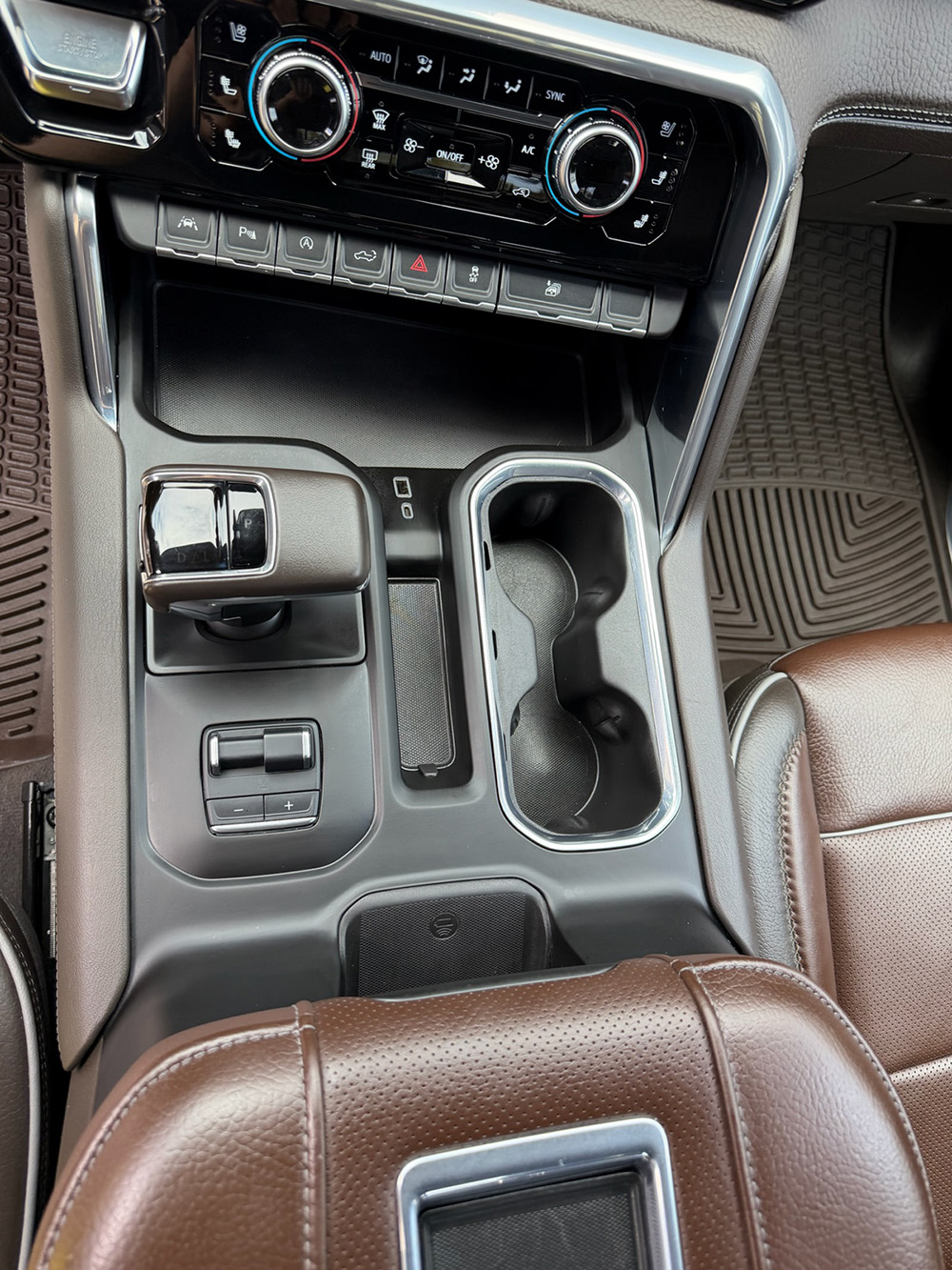 Truck center console with wireless charging and cup holders after detailing