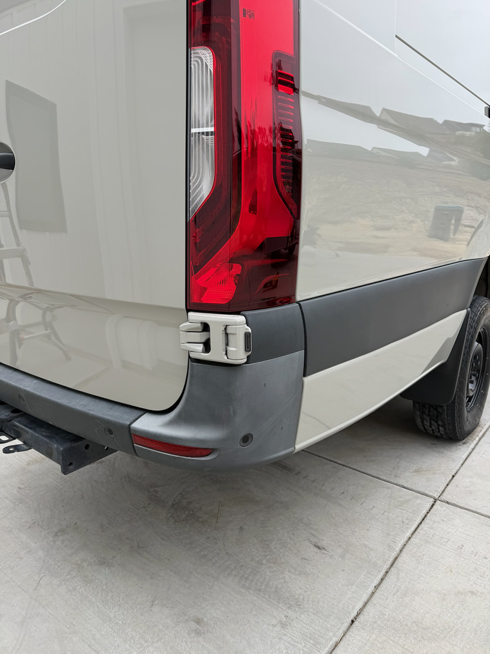 Van rear taillight exterior detail inspection after a coastal detailing service