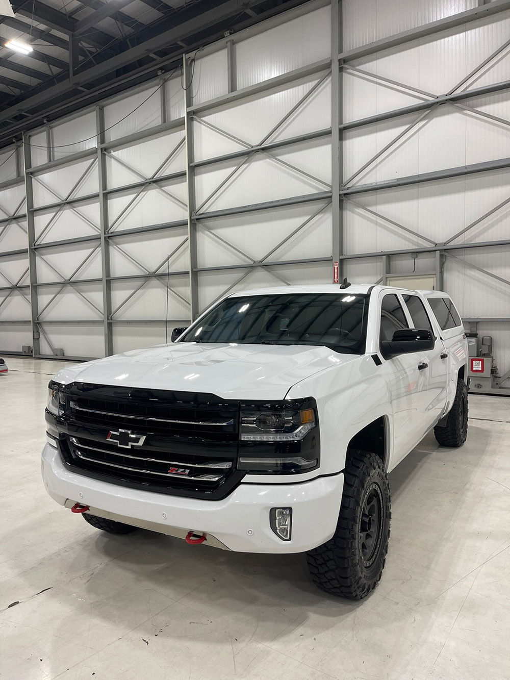 White Chevy Silverado Z71 mid paint correction, machine polishing swirl marks out of the clear coat